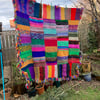 Hand knitted chunky multicoloured blanket 