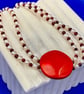 Double strand of pearls and garnets with vintage bakelite