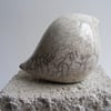 Raku glazed baby bird