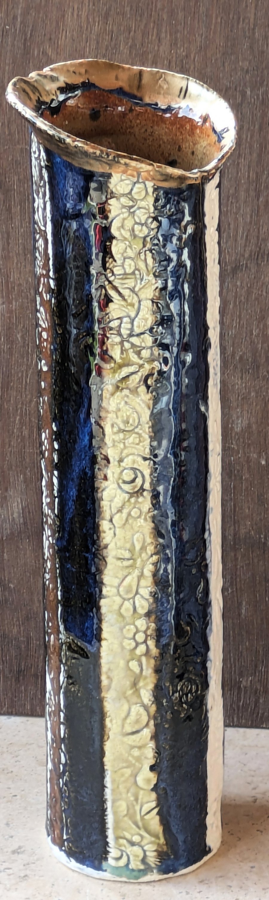 Delightful stoneware, flower decorated blue vase