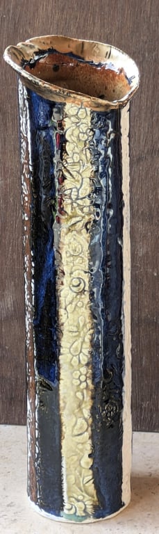 Delightful stoneware, flower decorated blue vase