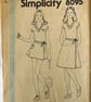 An uncut sewing pattern for a girl's t-shirt top and wrap skirt in 2 lengths 