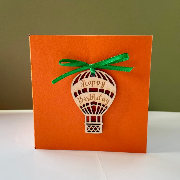 Blank card with detachable wooden 'Happy Birthday' balloon decoration