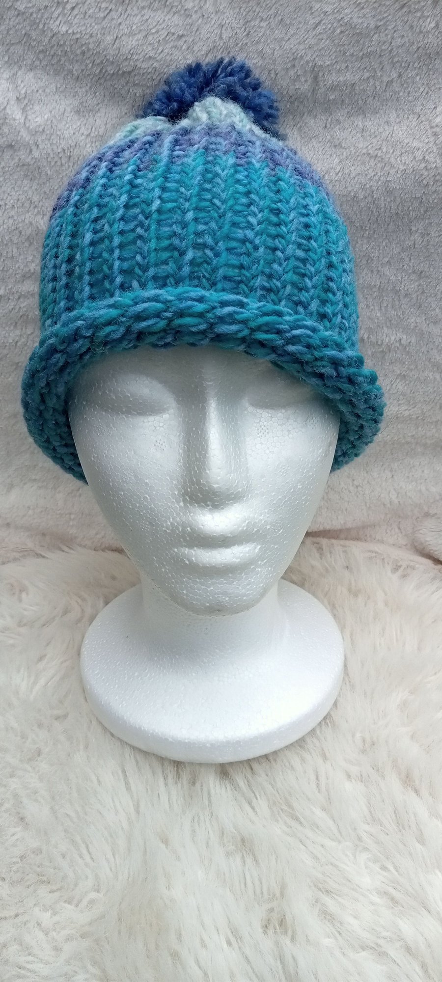 Hand-woven bobble hat, made with chunky wool for warmth.