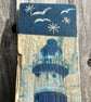 Cyanotype printed lighthouse on driftwood