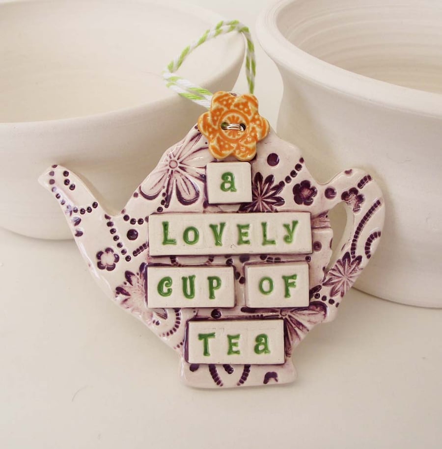 Ceramic teapot decoration with flower button