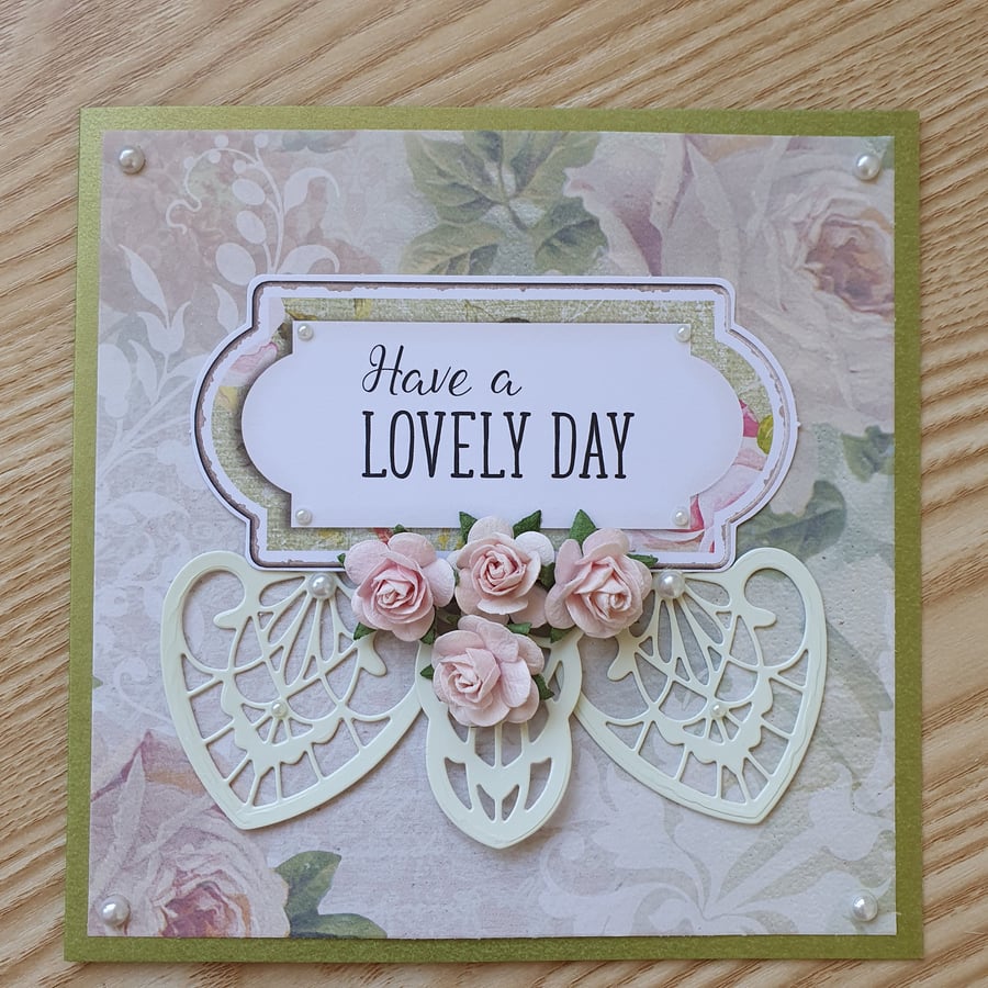 A floral die cut greetings card