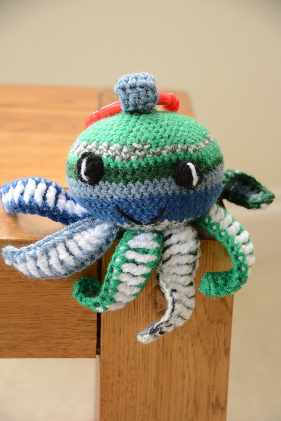 Octopus Soft Toy with teething ring and internal rattle - blue and green