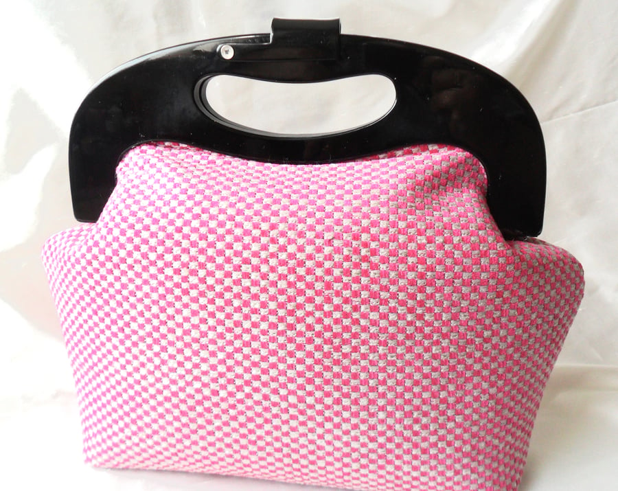 Retro style cerise handbag with black resin frame. 