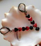 Red & Black Hematirte Gemstone Heart Dangle Earrings - Image 2
