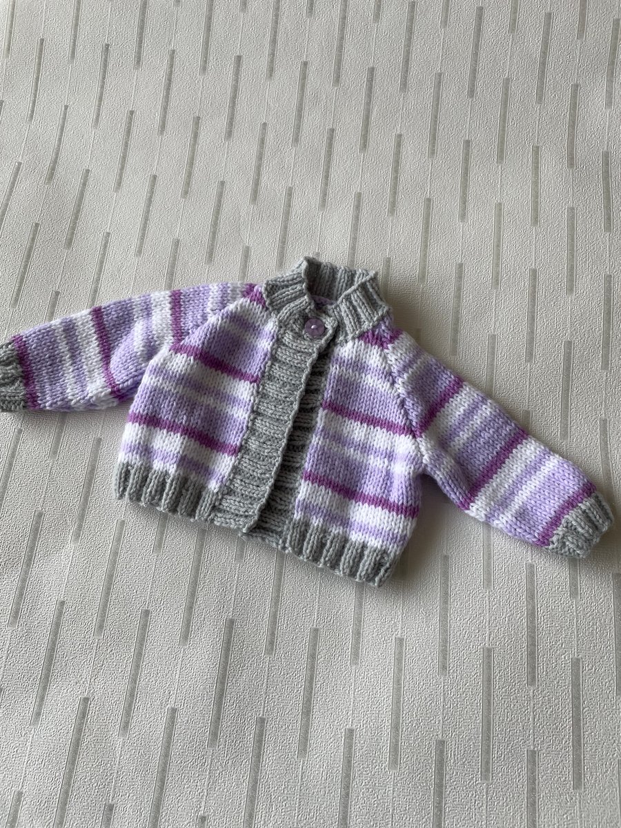Striped cardigan for a newborn baby