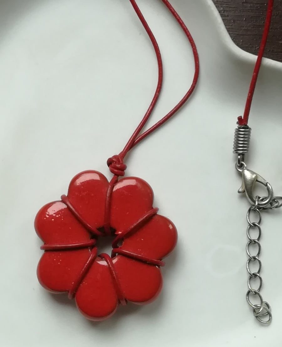 Red flower pendant wrapped in cord