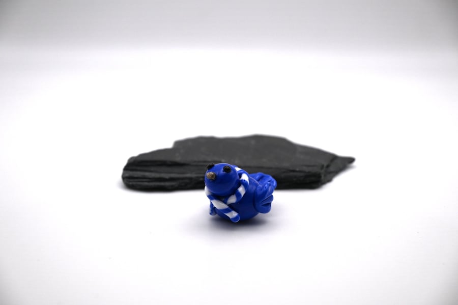 small glass blue football bird
