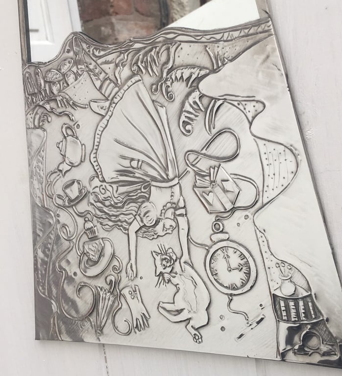 Alice in wonderland mirror. Pewter mirror Alice falling down the rabbit hole.