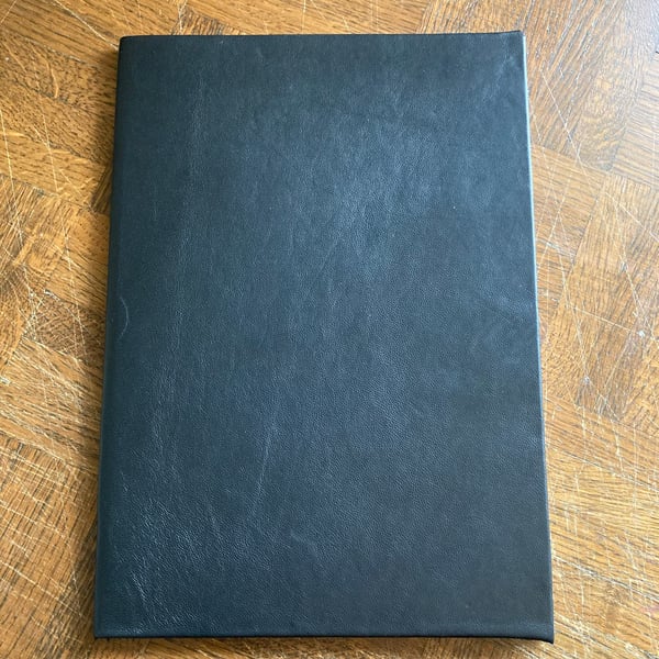 A4:  Softcover Black leather bound A4 sized lined notebook - journal 