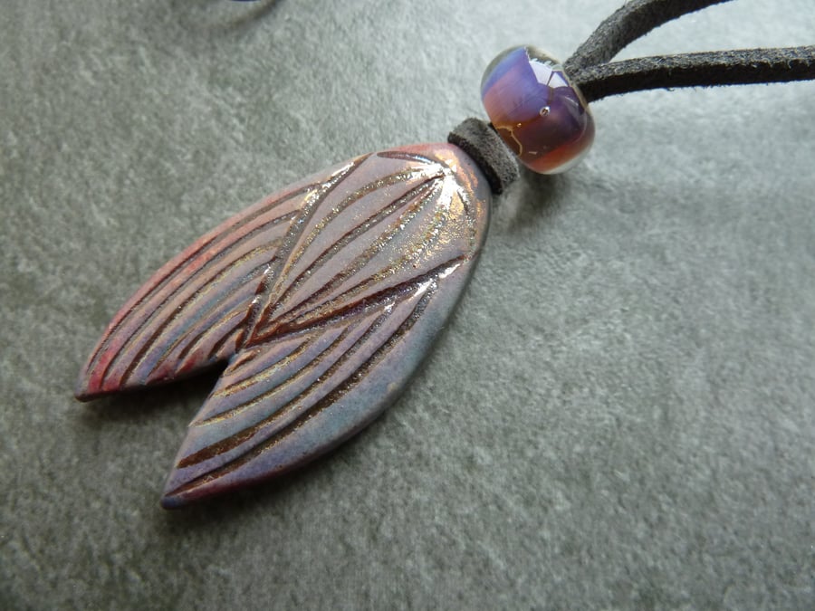 faux suede necklace, ceramic moth pendant