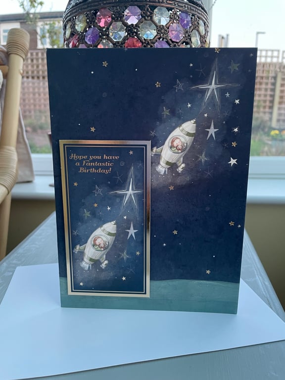 A little boy in a spaceship happy birthday card