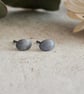 Brushed dark stud earrings; tactile everyday silver studs
