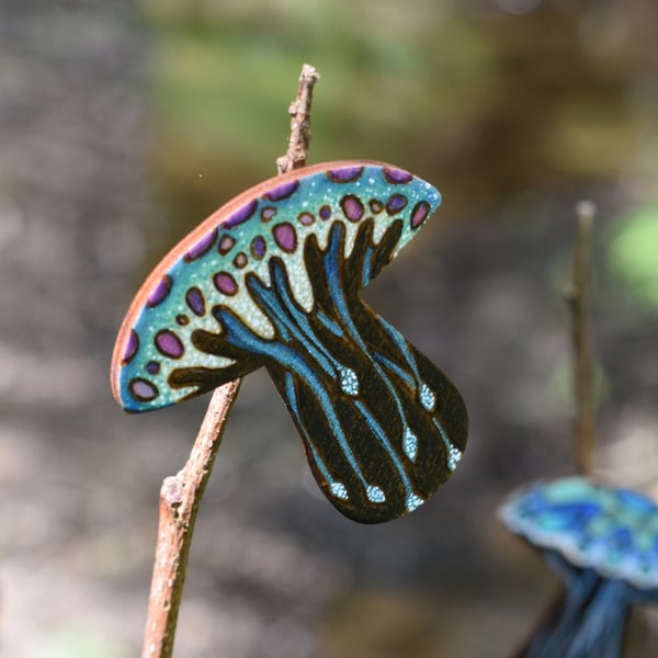 Blue jellyfish brooch hand burned using pyrography.