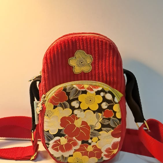 Red corduroy phone bag with golden flowers 