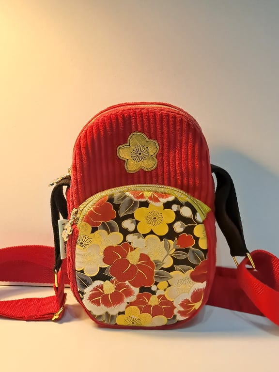 Red corduroy phone bag with golden flowers 
