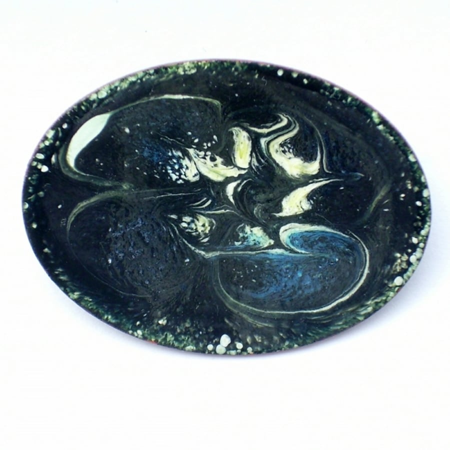 large oval brooch - scrolled white, cream and blue over black