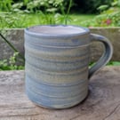 Hand-thrown, stoneware mug in "granite" glaze with a white liner 68,