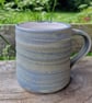 Hand-thrown, stoneware mug in "granite" glaze with a white liner 68,