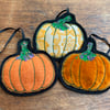Embroidered up-cycled pumpkin home decorations. 