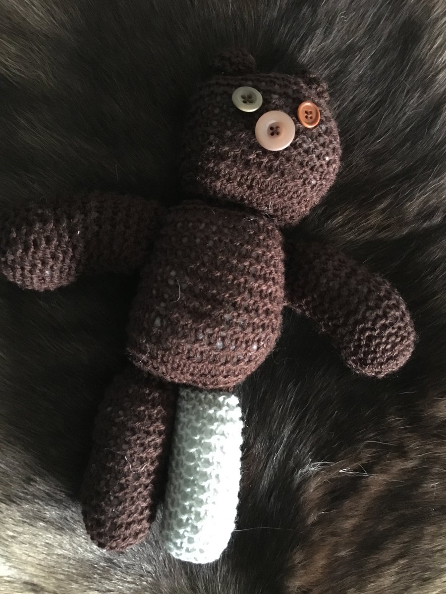 Hand knitted button-eye teddy bear