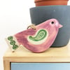 Ceramic bird decoration with patterned wing and tail 