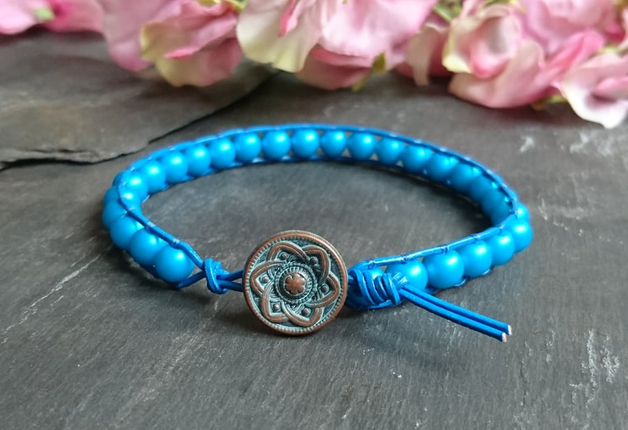 Turquoise glass pearl and blue leather bracelet with copper button