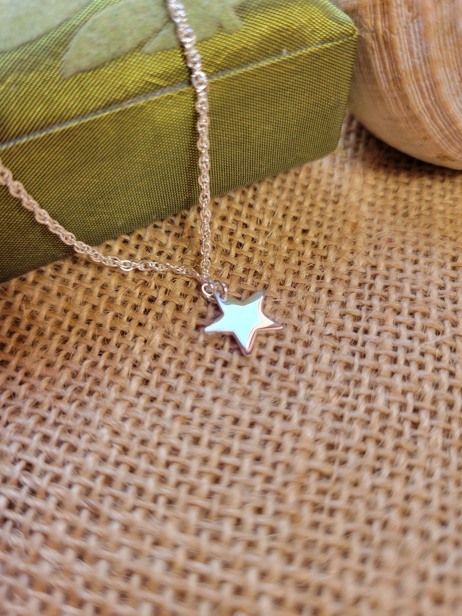 Sterling silver star initial pendant. 
