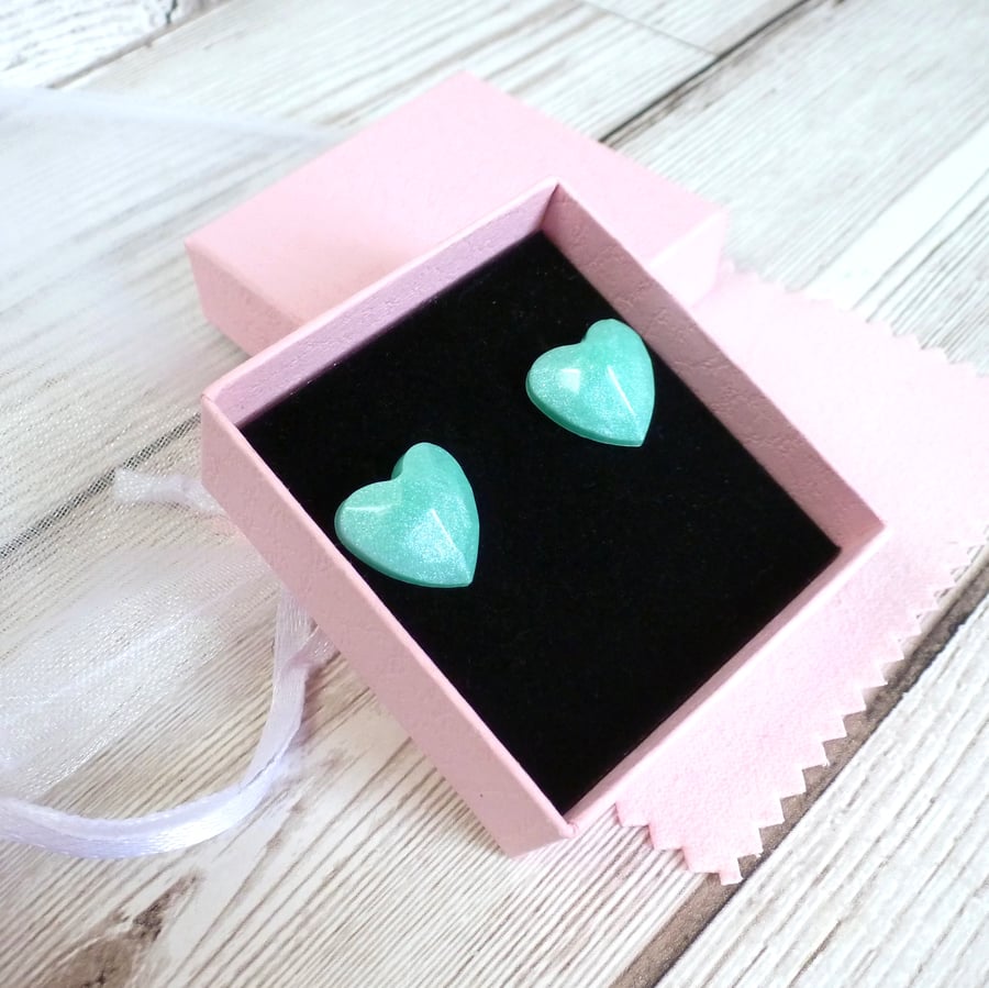 Turquoise shimmering heart studs. Pastel resin heart-shaped earrings for women