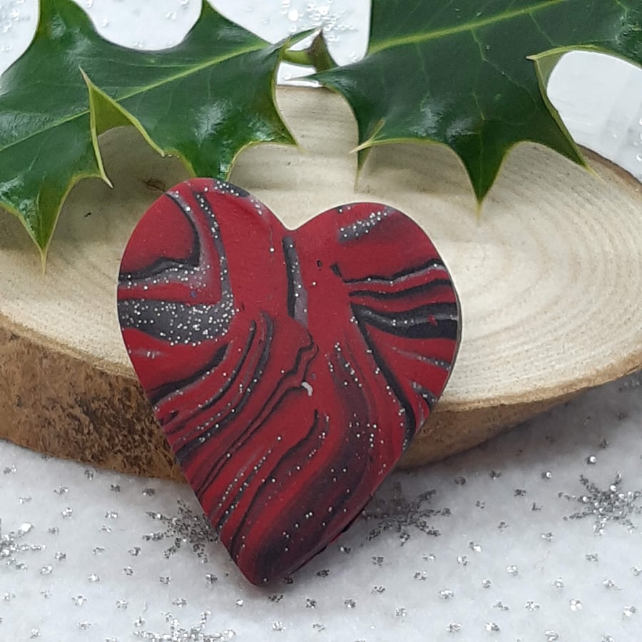 Red,black and silver heart shaped brooch