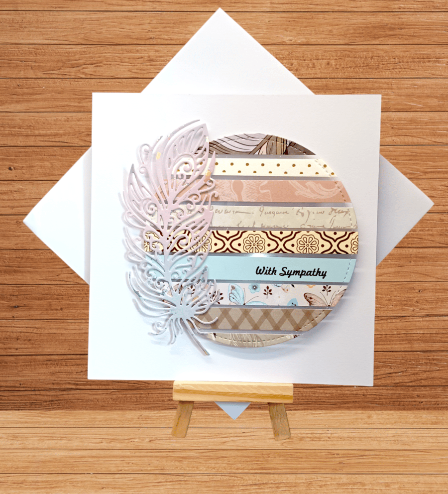 Beautiful striped sympathy card with feather decoration