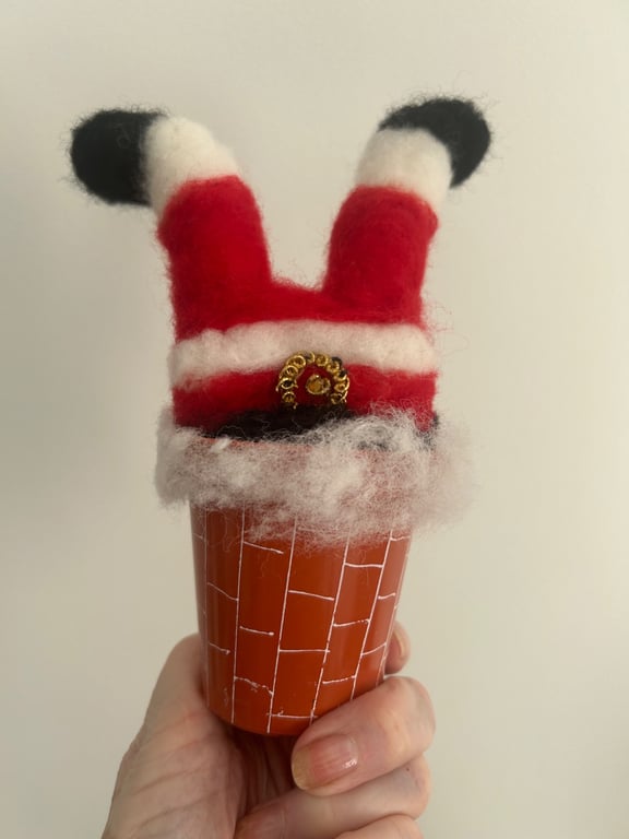 Santa going down the chimney 