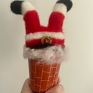 Santa going down the chimney 