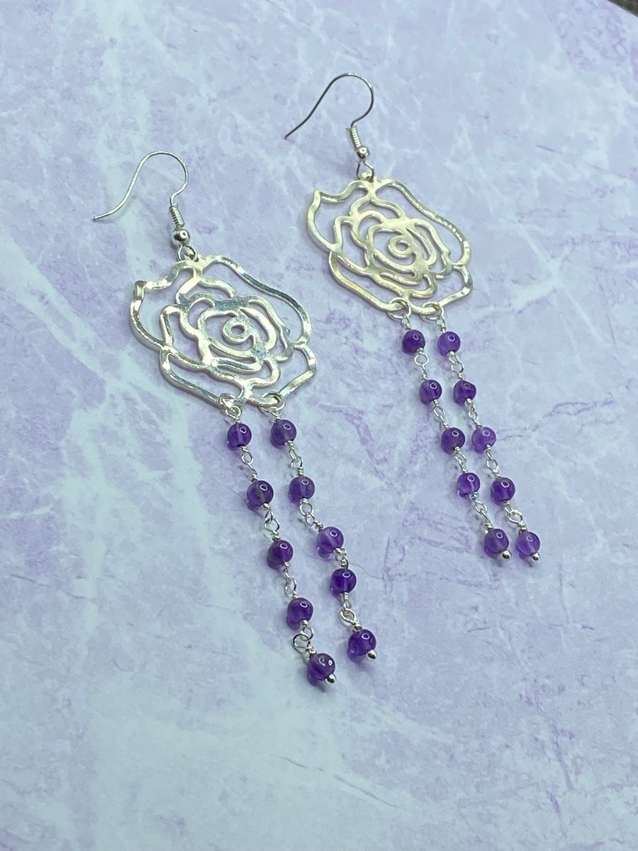 Silver tone filigree rose dangle earrings with amethyst stones