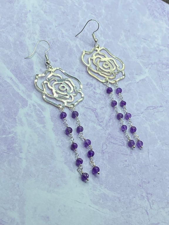 Silver tone filigree rose dangle earrings with amethyst stones