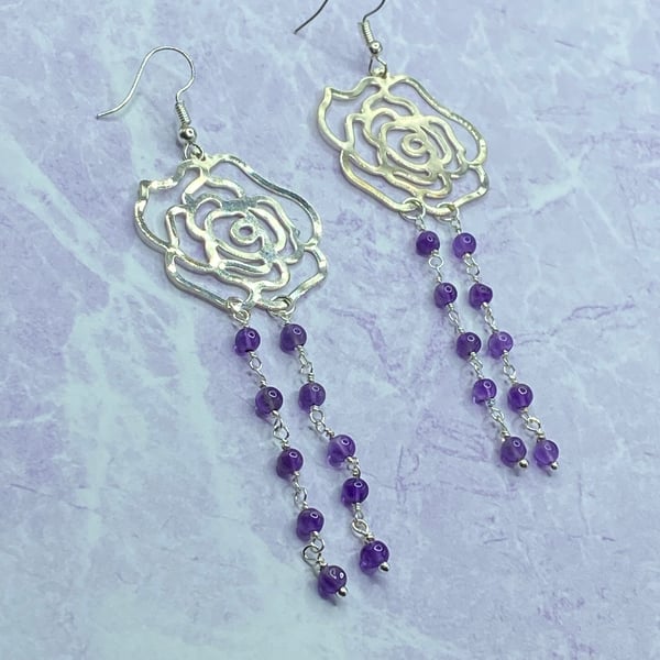 Silver tone filigree rose dangle earrings with amethyst stones