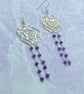 Silver tone filigree rose dangle earrings with amethyst stones