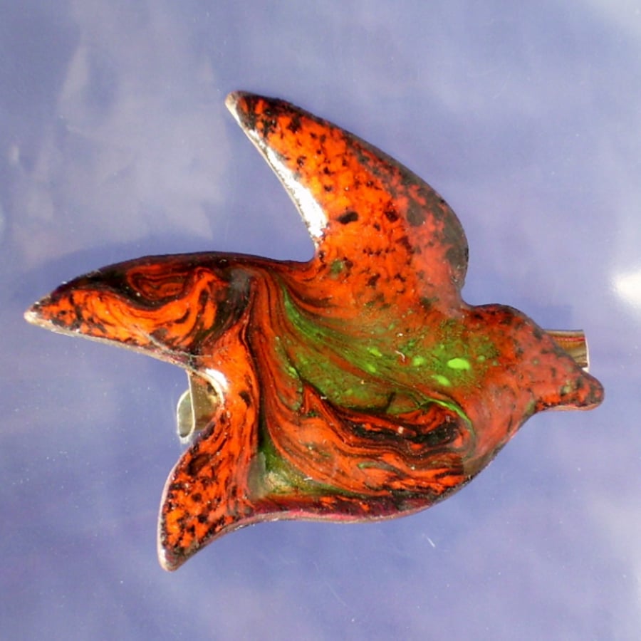 green and black over red, scrolled enamel bird brooch