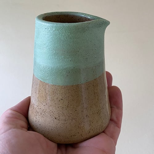 Turquoise speckled pourer.