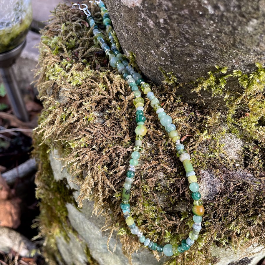 Gemstone and sterling silver bead necklace in greens.