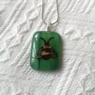 Hand painted bee necklace on green glass