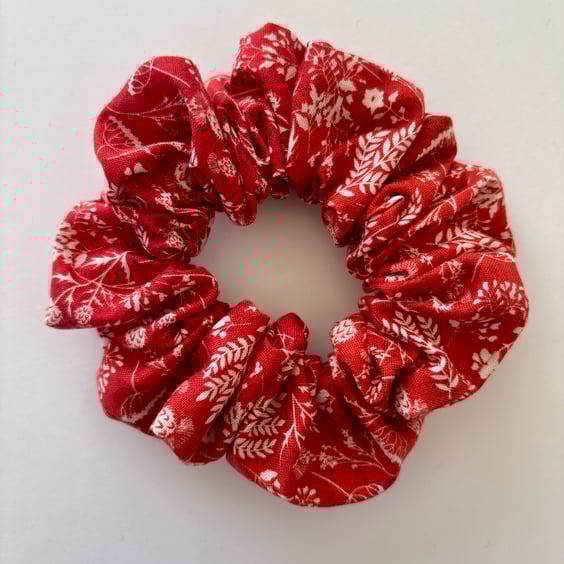 Cotton scrunchie hair accessory in a floral print in red and cream.