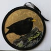 Blackbird oil painting on hanging round panel