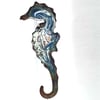 Seahorse - scrolled white and pink on blue over clear enamel