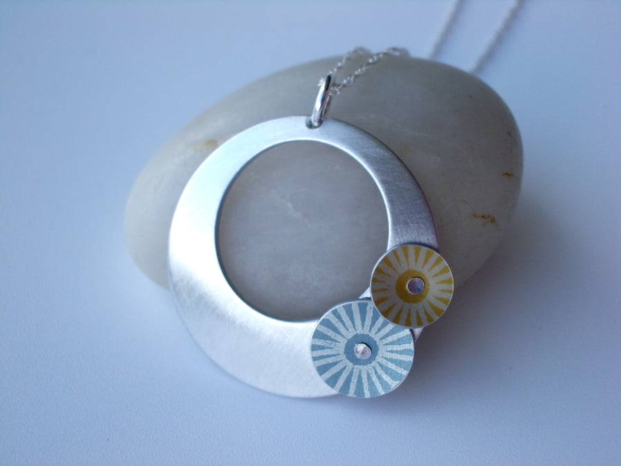 Circle pendant necklace in brushed aluminium with grey and yellow discs